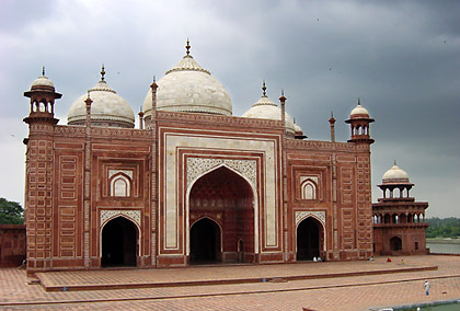a red sandstone and white marble building on the east or west wing of the Taj Mahal