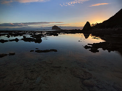 Diguisit Beach sunrise with the Aniao Islets in the background