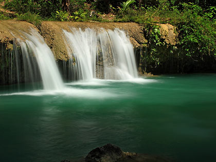 at the third level of Cambugahay Falls in Lazi
