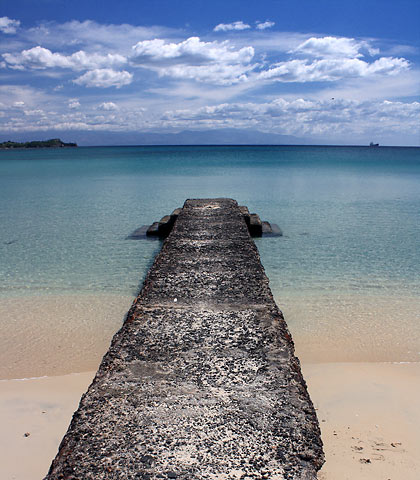 small pier jutting out from Tambobong Beach, Dasol