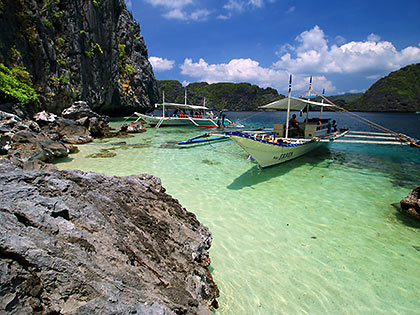motorized outrigger boats at Tapiutan Island